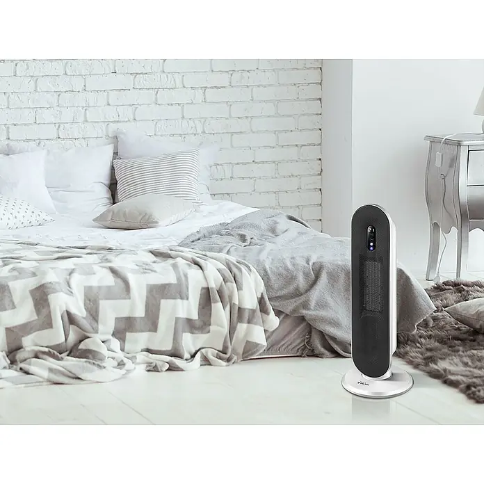 Purline Calefactor de aire digital HOTI T40 - 2.000 W, Negro - Elegante calentador en un dormitorio. El diseño elegante del calentador se mezcla con la decoración moderna del dormitorio, dando calor.