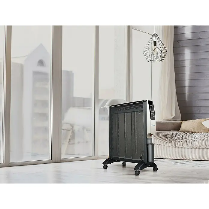 Purline Calefactor radiante de mica RMD 2000 - 2.000 W, 13 x 56 x 67 cm - Primer plano de un elegante calefactor negro con una ventana luminosa de fondo.