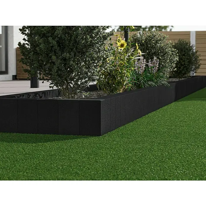 Diephaus Rechteckpalisade - 16,5 x 12 x 40 cm, Anthrazit, Beton - Ein erhöhter, schwarzer Gartenbeet mit üppigen Pflanzen und saftigem grünem Rasen. Die perfekte Gartengestaltung für einen stilvollen Außenbereich.