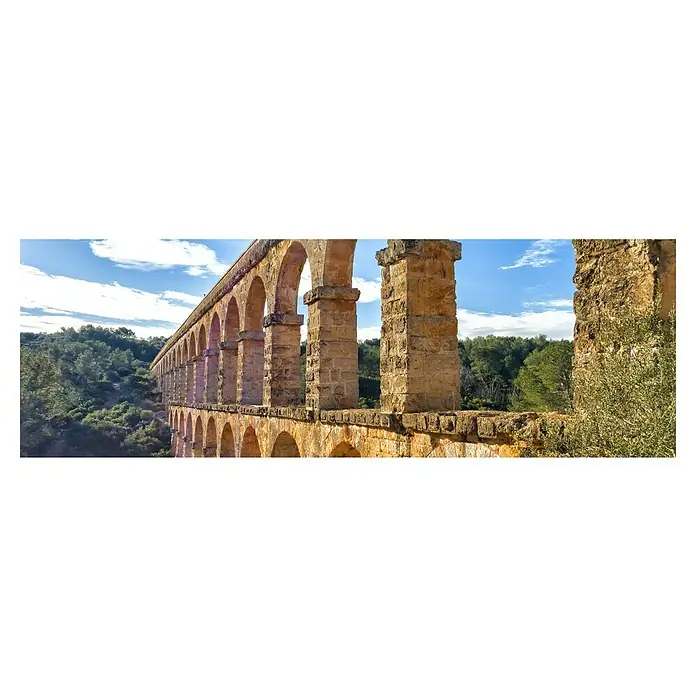 Cuadro Acueducto Romano - Acueducto Romano, An x Al: 120 x 40 cm, 1 pzs. - Una imagen detallada muestra el histórico Acueducto de les Ferreres, una estructura impresionante que testifica la ingeniería romana.