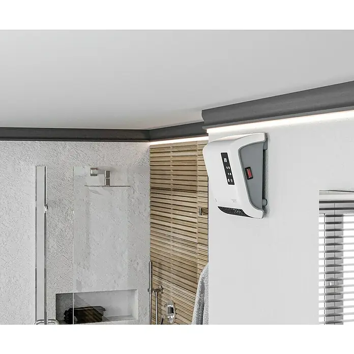 Voltomat HEATING Heizlüfter - 1.000 W - 2.000 W, Weiß, 29,5 x 19 x 31,6 cm, IP22 - Nahaufnahme einer Wandheizung in einem Badezimmer.