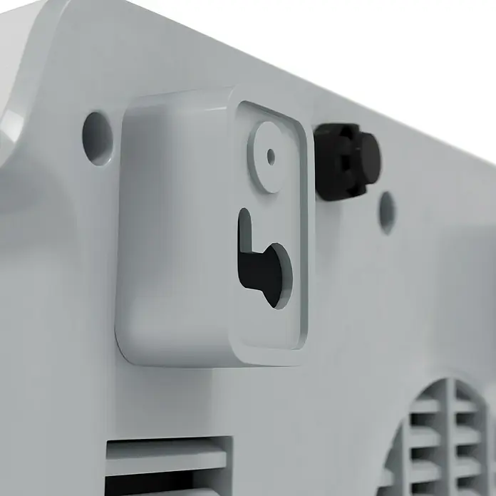 Voltomat HEATING Heizlüfter - 1.000 W - 2.000 W, Weiß, 29,5 x 19 x 31,6 cm, IP22 - Detailaufnahme eines weißen Gehäuses mit schwarzem Knopf und rechteckigen Aussparungen, vermutlich Teil eines elektronischen Geräts.