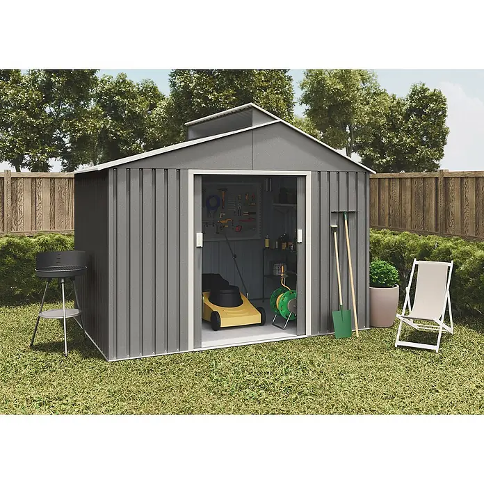 Hoggar Gerätehaus Björn - Außenmaß inkl. Dachüberstand (B x T): 282 x 257 cm, Anthrazit, Grundfläche: 7,25 m² - Ein graues Metallgartenhaus mit offenem Eingang, in dem sich Gartengeräte wie ein Rasenmäher befinden.