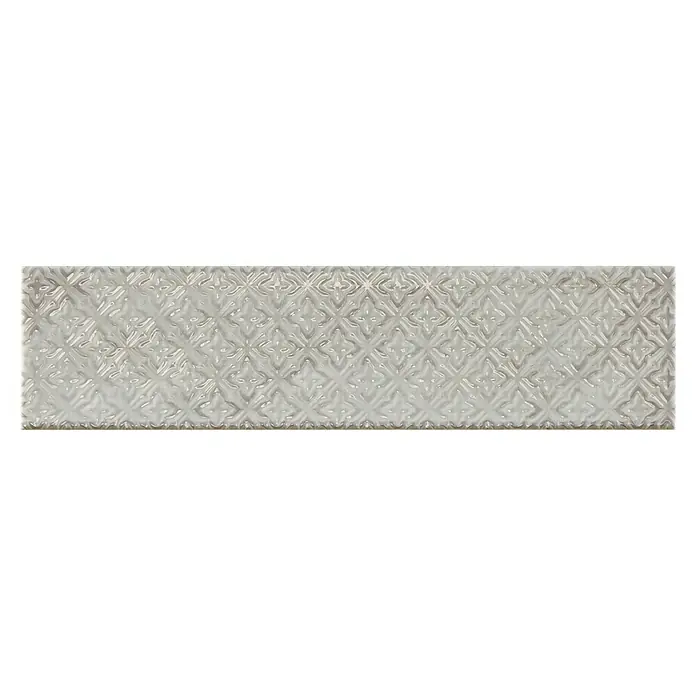 BHS Showroom Revestimiento de pared Rain Decor - 7,5 x 30 cm, Grigio, Brillante - Esta imagen muestra una sola baldosa de cerámica gris alargada con un patrón en relieve en forma de rombo, ideal para revestimientos de paredes elegantes.