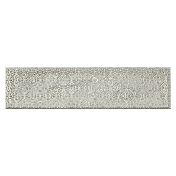 BHS Showroom Revestimiento de pared Rain Decor - 7,5 x 30 cm, Grigio, Brillante - Azulejo gris oblongo con un diseño floral de filigrana en relieve que añade un toque decorativo al espacio.