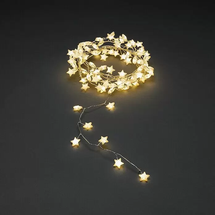 Konstsmide LED-Lichterkette - Innen, Lichtfarbe: Warmweiß, Anzahl Leuchtmittel: 90 Stk., Netzbetrieben - Warme weiße sternförmige LED-Lichterkette, teilweise aufgerollt.