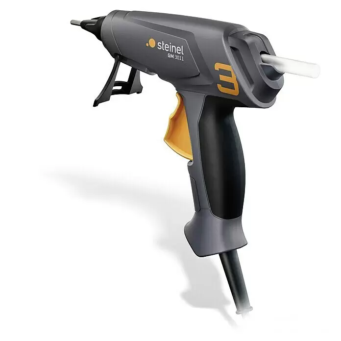 Steinel Heißklebepistole GlueMatic 3011 - Durchmesser Klebepatrone: 11 mm, Temperaturbereich: 200 °C - Graue und schwarze Heißklebepistole mit gelbem Abzug, Metalldüse, weißem Klebestift und ausklappbarem Ständer.