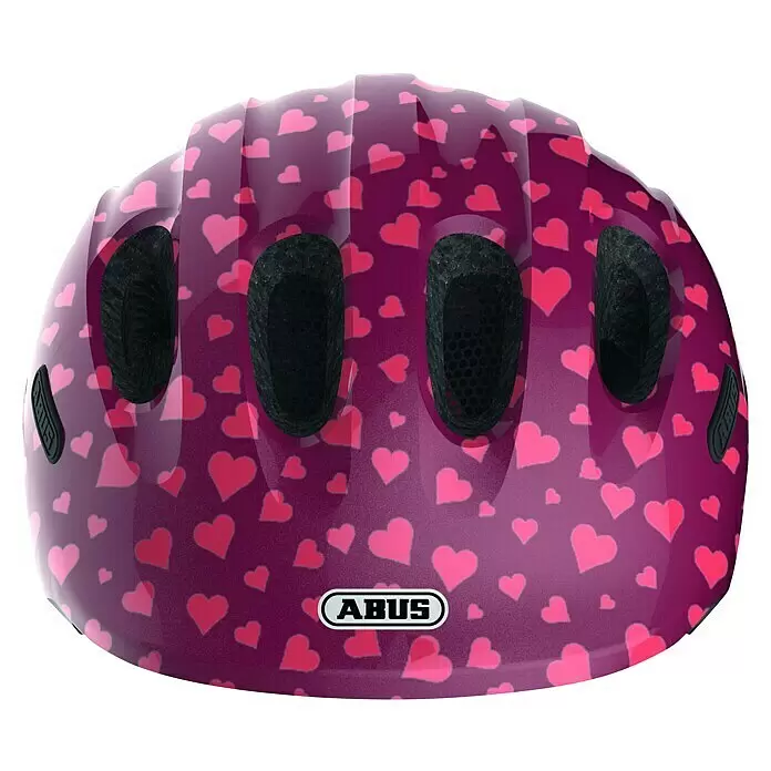 Abus Fahrradhelm Kids Pro - M, Weinrot/Pink - Violetter Helm mit rosa Herzmuster, schwarzen Lüftungsschlitzen und ABUS-Logo.