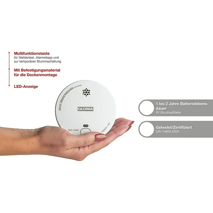 Gloria Rauchwarnmelder R-1 - Durchmesser: 100 mm, Batterielaufzeit: 2 Jahre, Alarmsignal: 85 dB - Rauchmelder Gloria in der Hand, mit Hinweisen zu Funktionen, Batterielaufzeit und Zertifizierung.