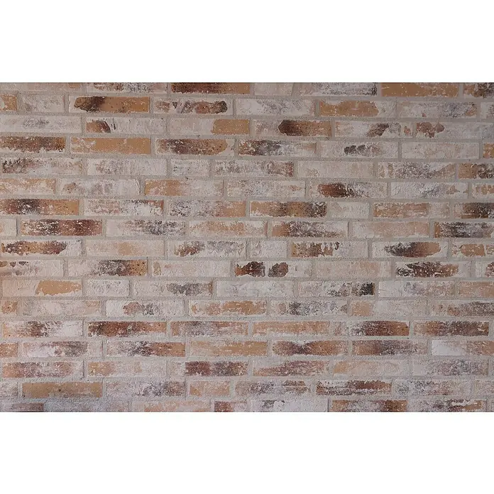 Celina Klinker Verblendstein Vintage Paris - 5,2 x 24 cm, Gelb/Weiß, Steinoptik - Das Bild zeigt eine detailreiche Backsteinmauer mit rustikalem Charme, die eine warme und einladende Atmosphäre vermittelt.
