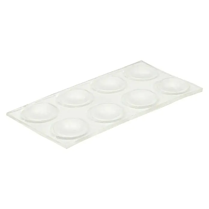 Wagner System Möbelgleiter - Durchmesser: 8 mm, Rund - Eine Nahaufnahme einer Packung transparenter, halbkugelförmiger Stoßdämpfer, die auf einer durchsichtigen Trägerfolie angeordnet sind.