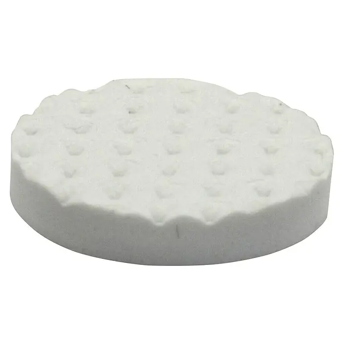 Wagner System Softpads - Ø x H: 19 x 3 mm, 16 Stk., Weiß, Kleben - Nahaufnahme eines runden, weißen Toilettenreinigers mit Noppenstruktur auf schwarzem Hintergrund.