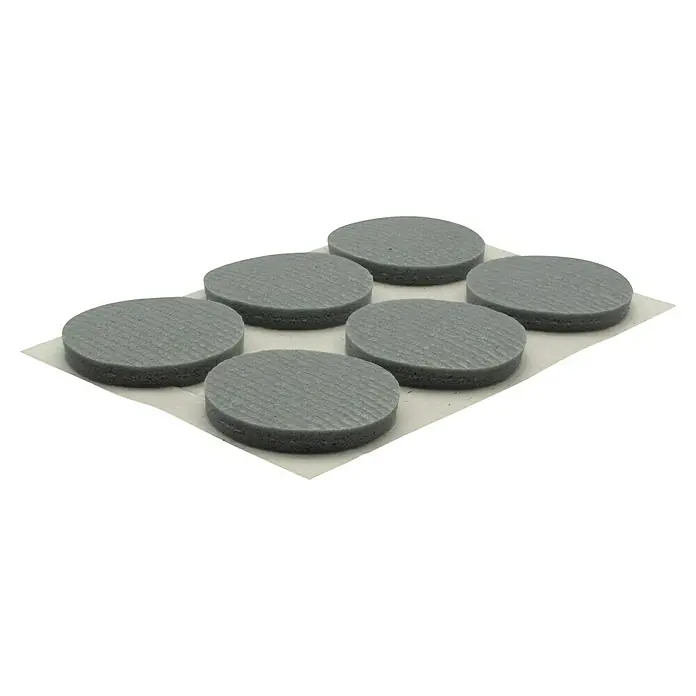 Wagner System Softpads - Ø x H: 28 x 4 mm, 12 Stk., Grau, Kleben - Sieben graue, runde Pads auf weißem Papier. Die Pads haben eine geriffelte Oberfläche und sind gleichmäßig auf dem Papier verteilt.
