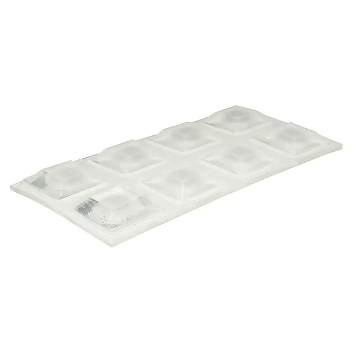 Wagner System Plastik-Gleiter - Transparent, L x B x H: 12,7 x 12,7 x 3 mm - Nahaufnahme eines transparenten, selbstklebenden Pads mit pyramidenförmigen Noppen für vielfältige Anwendungen.