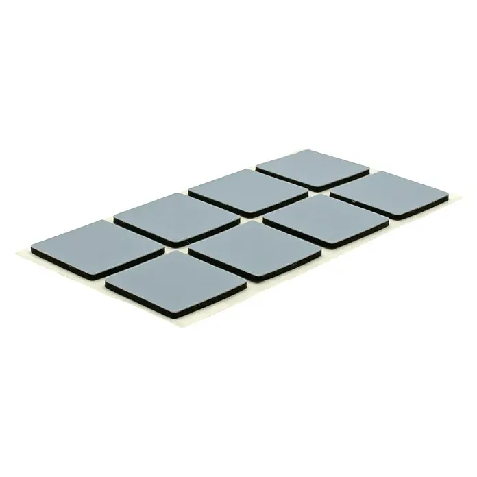 Wagner System Möbelgleiter - L x B x H: 20 x 20 x 1,5 mm, Kleben, 16 Stk. - Diese Aufnahme zeigt Wärmeleitpads auf einer weißen Unterlage. Die Pads sind quadratisch, grau und in einer Reihe angeordnet.