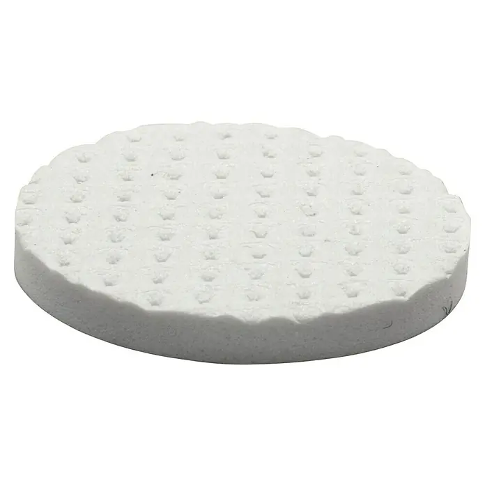 Wagner System Softpads - Ø x H: 28 x 3 mm, 12 Stk., Weiß, Kleben - Nahaufnahme eines runden, weißen Bimssteinpads mit kleinen, pyramidenförmigen Noppen, ideal für die Fußpflege und sanftes Peeling.
