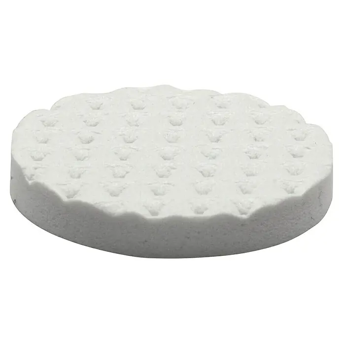 Wagner System Softpads - Ø x H: 22 x 3 mm, 12 Stk., Weiß, Kleben - Nahaufnahme eines weißen, runden Reinigungspads mit eingeprägten Mustern. Ideal für sanfte Hautreinigung und Make-up-Entfernung.