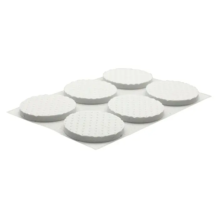 Wagner System Softpads - Ø x H: 28 x 3 mm, 12 Stk., Weiß, Kleben - Nahaufnahme von sechs weißen Frischkäsetörtchen auf einer hellen Unterlage, die eine delikate Textur und Form zeigen.