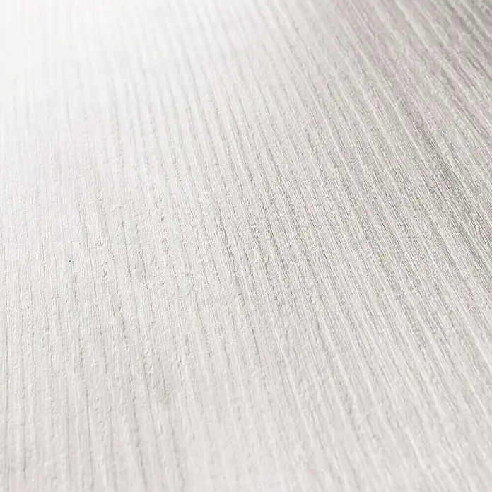 GetaDoor Lamineo Zimmertür GLN 15 - 735 x 1.985 mm, DIN Anschlag: Links, Pinie Polar, Röhrenspan - Nahaufnahme einer weißen Holzstruktur, ideal für Hintergründe oder Texturen in Designprojekten. Die Maserung ist deutlich sichtbar.