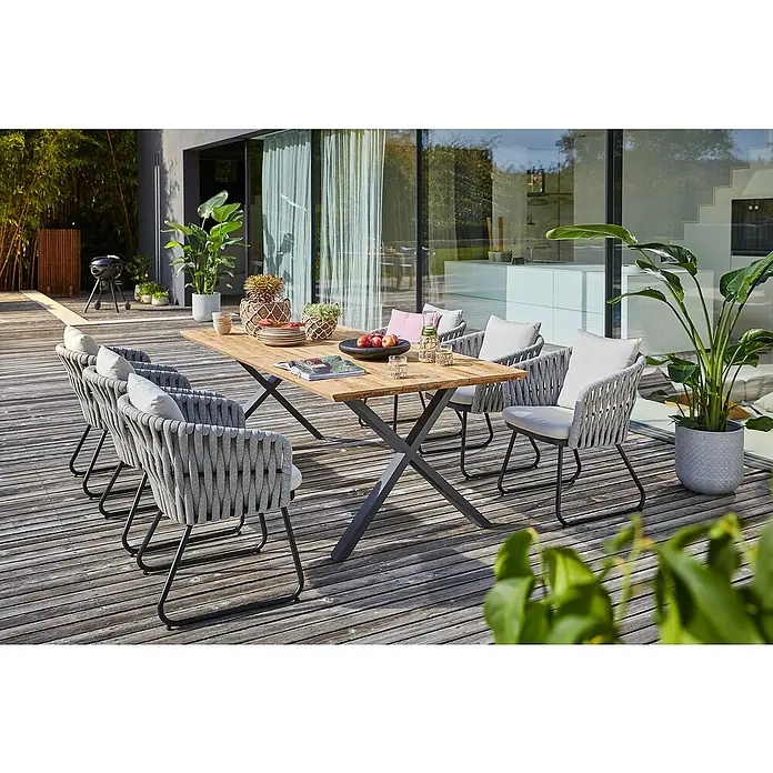Sunfun Maja Gartenmöbel-Set - 8 -tlg., Teak/Edelstahl/Seilgeflecht, Teak/Grau/Beige, Schweizer-Kante/X-Gestell - Bild eines modernen Gartens mit einem Holztisch und Seilstühlen, die ein stilvolles Ambiente für Mahlzeiten im Freien schaffen.