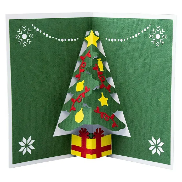 Cricut Maker Schneideplotter Maker 3 - Blau, Bluetooth, Schnittbreite: 29,7 cm, Schnittlänge: 3,6 m - Weihnachtliche Pop-Up-Karte mit einem festlich geschmückten Weihnachtsbaum und Geschenk, ideal für Weihnachtsgrüße.