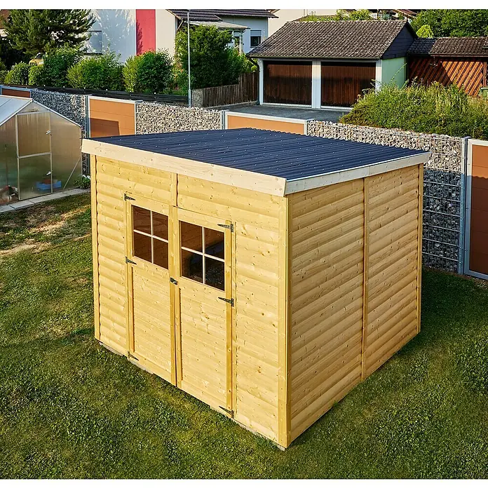 Gutta Guttanit Wellplatte - 2.000 x 900 x 2,25 mm, Kunststoff, Schwarz, 76/18 mm - Holzgartenhaus mit Doppeltür und Fenstern unter einem blauen Dach. Es steht auf einer grünen Rasenfläche mit Häusern im Hintergrund.