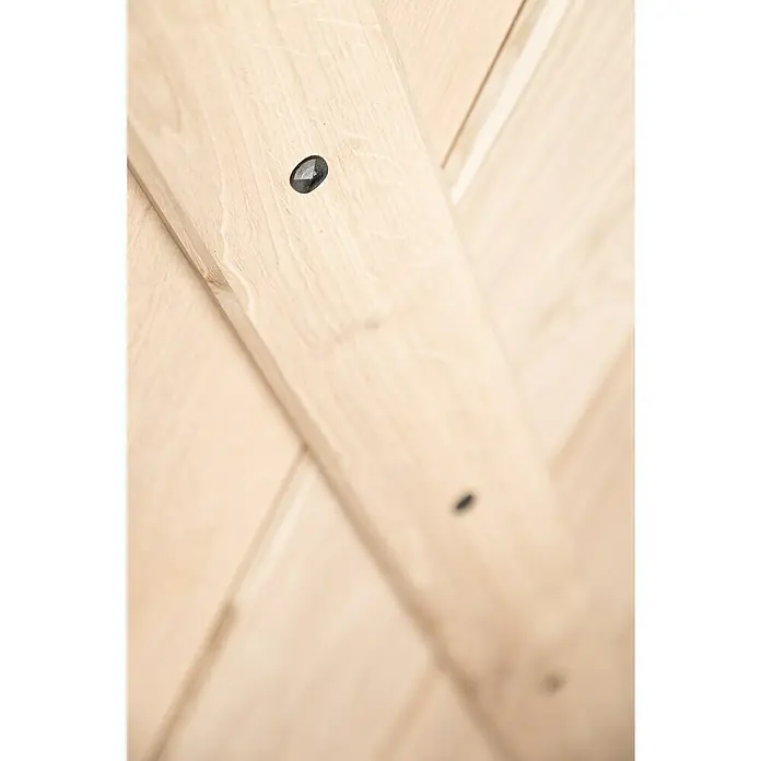 Kornik Holzschiebetür Loft - 96 x 206 cm, Eiche - Nahaufnahme eines hellen Holzprodukts mit dekorativen, dunklen Akzenten, die dessen natürliche Maserung hervorheben.