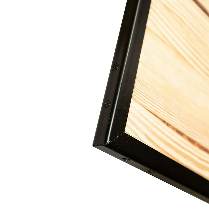 Kornik Holzschiebetür Industrial Eko - 93 x 206 cm, Kiefer - Detailaufnahme eines Holzrahmens mit schwarzem Metallrand, der mit Schrauben befestigt ist. Die Holzmaserung ist gut sichtbar.
