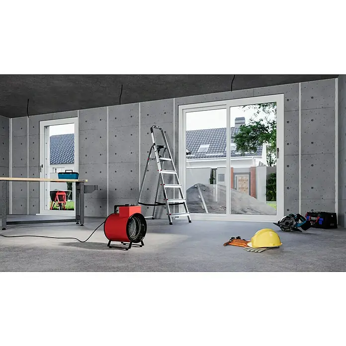 Voltomat HEATING Bauheizer - Passend für: Raumgröße bis ca. 35 m², 1.000 W - 3.000 W, Nennspannung: 220 V - 240 V, Rot, IP24 - Das Bild zeigt einen roten Heizlüfter in einem unfertigen Raum, der für Baustellen geeignet ist.