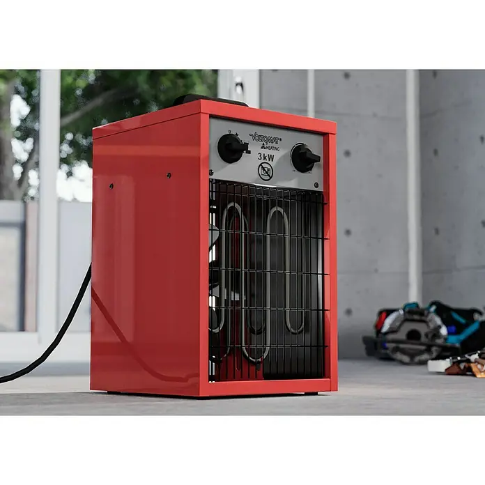 Voltomat HEATING Bauheizer - Passend für: Raumgröße bis ca. 25 m², 1.000 W - 3.000 W, Nennspannung: 220 V - 240 V, Rot, IP24 - Nahaufnahme einer roten Voltomat Heizung mit schwarzem Kabel und schwarzem Gitter vor den Heizelementen, mit Bedienelementen oben.