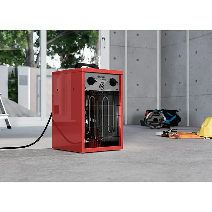 Voltomat HEATING Bauheizer - Passend für: Raumgröße bis ca. 25 m², 1.000 W - 3.000 W, Nennspannung: 220 V - 240 V, Rot, IP24 - Roter Vossner Atlantic 3kW Heizlüfter auf einem Betonboden in einer Baustelle.
