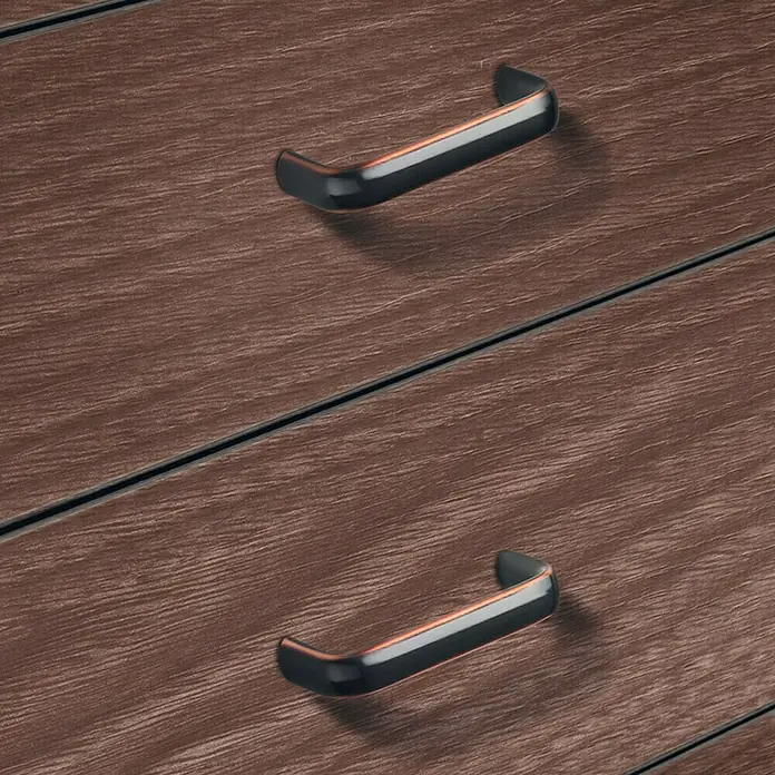 Häfele Tirador para muebles 117.64.114 - L x An x Al: 7 x 3 x 1,2 cm, Acero - Primer plano de dos cajones con elegantes tiradores curvos, destacando la textura y el diseño del mueble.