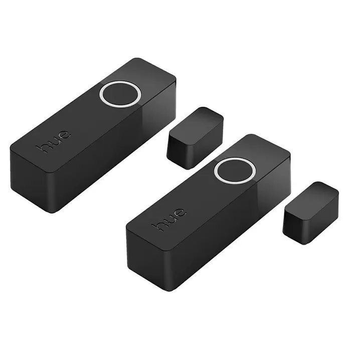 Philips Hue Sensor de ventana y puerta - Negro, ZigBee, 2 unidades - Vista aérea de dos interruptores de atenuación Philips Hue negros y mandos a distancia que los acompañan sobre un fondo negro.