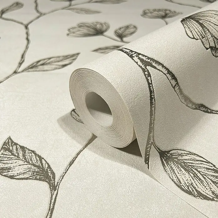 Marburg GZSZ Vliestapete Blumenranke - Beige/Gold, Floral, 10,05 x 0,53 m - Nahaufnahme einer Rolle weißer floral gemusterter Tapete, die Eleganz und Stil für die Raumgestaltung bietet.