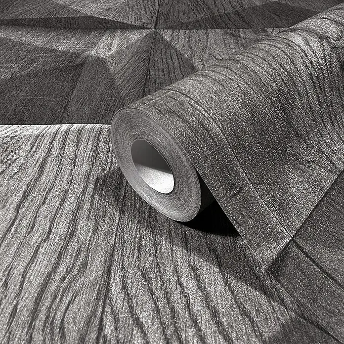 Marburg GZSZ Vliestapete Holzwand - Dunkelgrau, 3D-Optik, 10,05 x 0,53 m - Nahaufnahme einer Rolle strukturierten, grauen Vliestapete mit fühlbarer Oberflächenstruktur.
