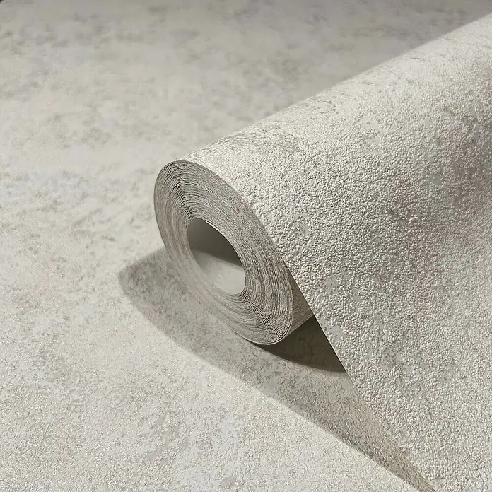 Marburg GZSZ Vliestapete - Shadow-Cremebeige, Uni, 10,05 x 0,53 m - Nahaufnahme einer Rolle grauer, strukturierter Tapete, die ein elegantes und modernes Design für die Inneneinrichtung zeigt.