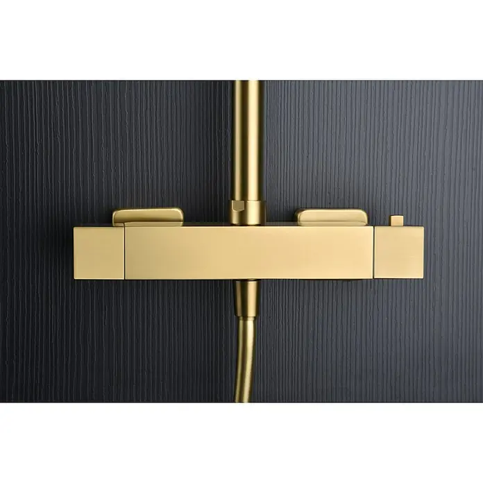 Imex Art Sistema de ducha - Grifo termostático, Oro - Primer plano de un elegante conjunto de ducha dorado, con un diseño minimalista sobre un fondo negro mate para una experiencia de baño lujosa.