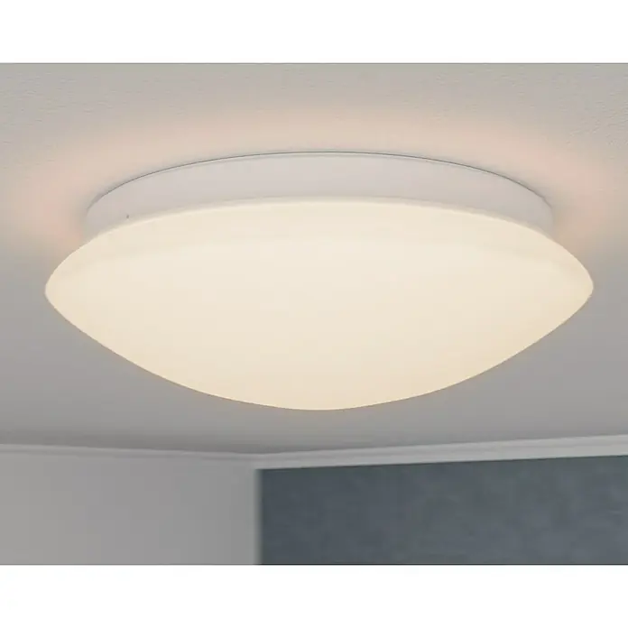 Steinel Sensor-Wand- & Deckenleuchte RS 16 L weiß - 60 W, L x B x H: 27,5 x 27,5 x 9,5 cm, Weiß, E27 - Nahaufnahme einer weißen Deckenleuchte, die ein sanftes, warmes Licht ausstrahlt. Das moderne Design passt gut in jeden Raum.