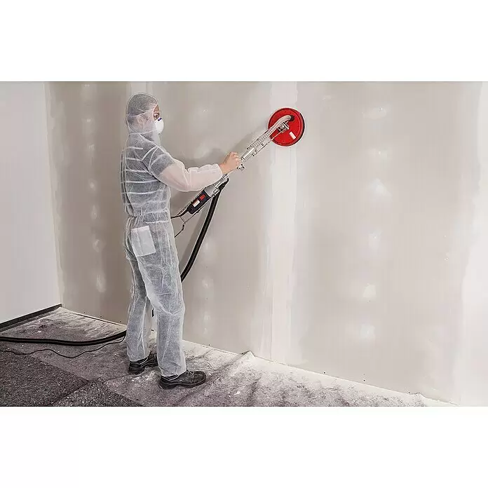 Wolfcraft Disco de lijado - Diámetro: 225 mm, Grano: 220 mm - Persona con traje protector lijando una pared con una lijadora de pared roja y plateada de mango largo.