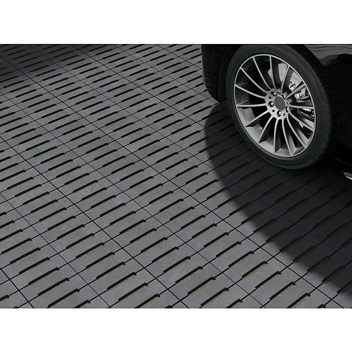 EHL Pflasterstein Modern Öko - Anthrazit, 50 x 25 x 8 cm, Rechteckig - Bild von strapazierfähigen Garagenbodenfliesen, die unter einem schwarzen Auto verlegt sind, ideal für die Werkstatt oder private Garage.