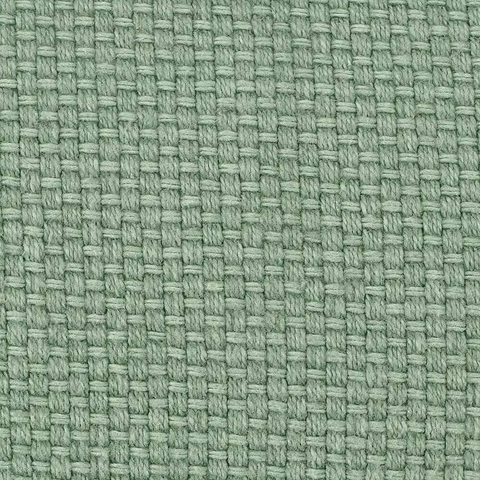 Kissen Bona - Jade, 45 x 45 cm, 100 % Baumwolle - Detailaufnahme eines hellgrünen, gewebten Stoffes, der eine feine Textur und ein dichtes Muster zeigt. Ideal für Möbelbezüge oder Dekorationszwecke.