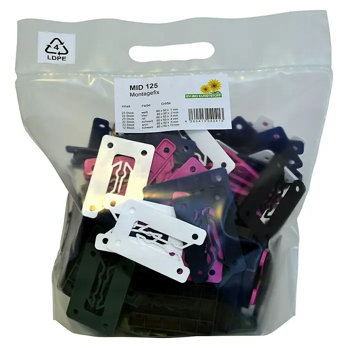 Abstandsklötze Quickfix - 125 Stk., Kunststoff - Eine durchsichtige Verpackung von "MID 125 Montagefix", die eine Vielzahl von Montageelementen in verschiedenen Farben und Größen enthält.