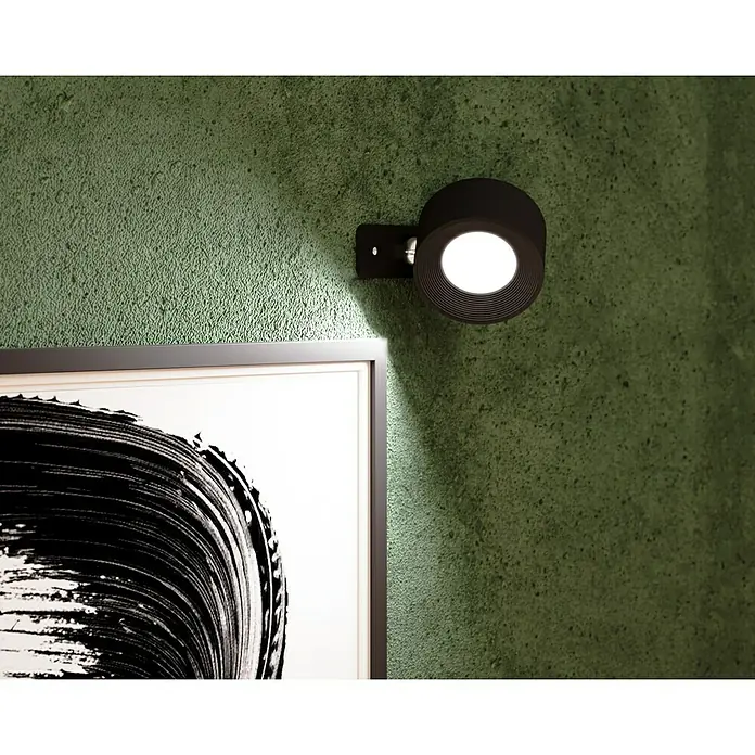 Lavida Akku-Wandleuchte Novara - L x B x H: 9,25 x 7,6 x 4,5 cm, 2 W, Schwarz, Mehrfarbig, Rund - Nahaufnahme einer modernen schwarzen Wandleuchte, die ein Kunstwerk beleuchtet und einen stilvollen Akzent setzt.