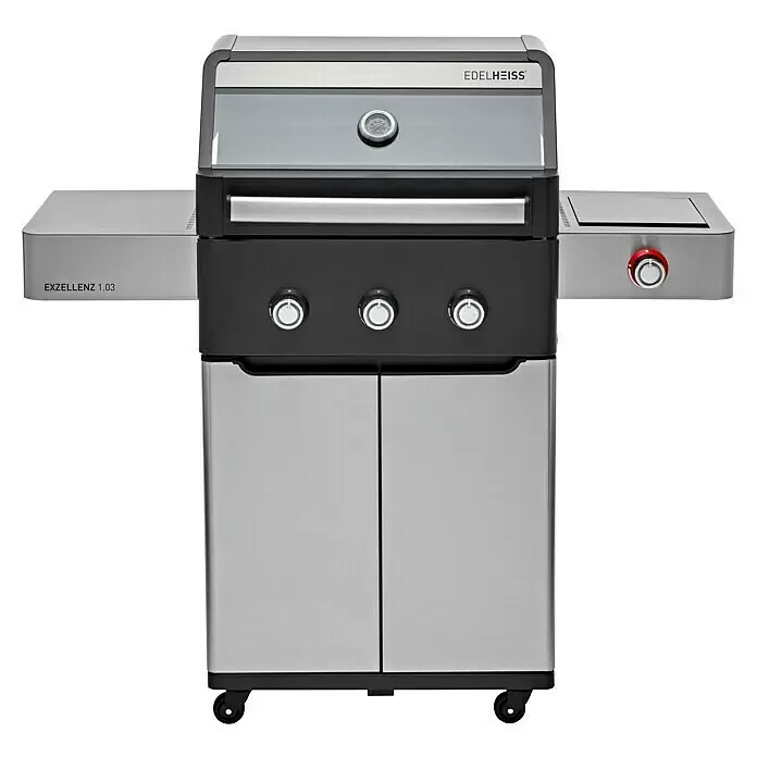 Edelheiss Gasgrill Exzellenz 1.3 - Grillfläche (B x T): 59 x 45,5 cm, 12,6 kW, Anzahl Brenner: 3 Stk. - Edelstahl- und schwarzer Gasgrill mit drei Brennern, Thermometer in der Haube und Seitenablagen mit rotem Bedienknopf.