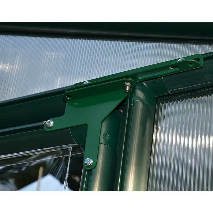 Palram – Canopia Invernadero Grand Gardener - Medidas ext. (An x Pr): 264,7 x 388,6 cm, Material de la pared lateral: Plástico, 0,8 mm, Verde - Primer plano de una unión angular verde de invernadero con tornillos, asegurando la estabilidad de la estructura.