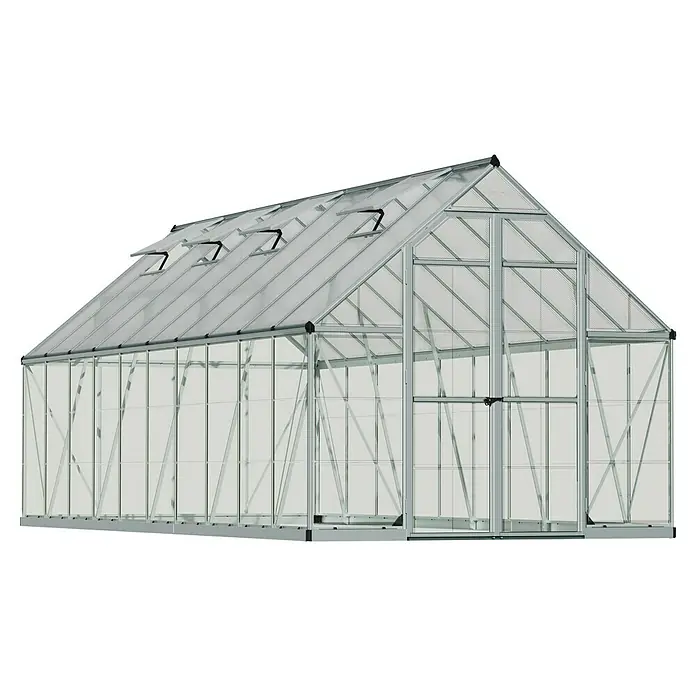 Palram – Canopia Invernadero Balance - Medidas ext. (An x Pr): 244 x 607 cm, 0,7 mm, Plateado - Imagen de un gran invernadero gris con muchas ventanas y una puerta. El invernadero está diseñado para el cultivo de plantas.