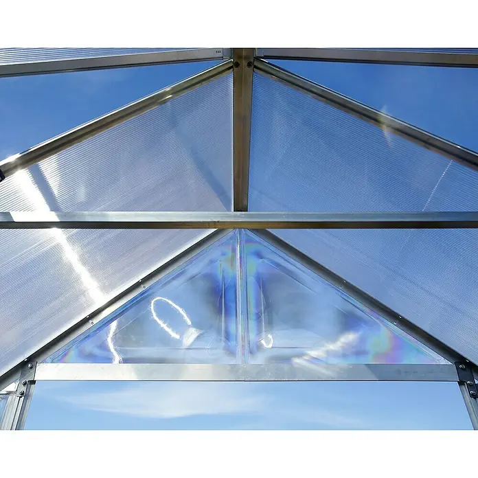 Palram – Canopia Invernadero Balance - Medidas ext. (An x Pr): 304 x 964 cm, 0,7 mm, Plateado - Primer plano del techo de un invernadero, con paneles de policarbonato transparente y estructura metálica plateada, mostrando una estructura robusta y translúcida.