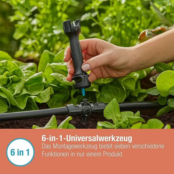 Gardena Micro-Drip Vorstecher - Passend für: Gardena Micro-Drip Artikel & Lochung des Verlegerohres, Kunststoff, Schwarz - Nahaufnahme des GARDENA 6-in-1-Universalwerkzeugs bei der Installation eines Bewässerungssystems im Garten.