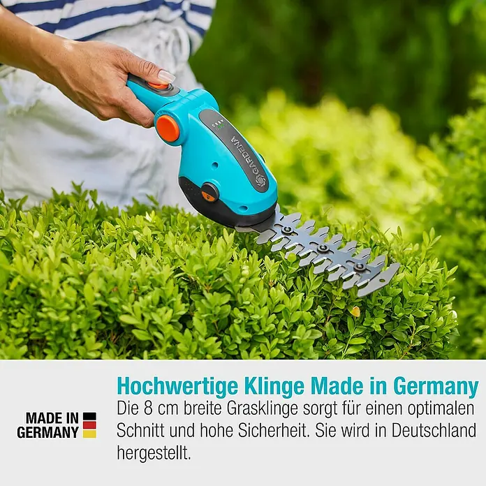 Gardena ComfortCut Akku-Gras- & Strauchschere Li - 3,6 V, Li-Ionen, 1 Akku, Schwertbreite: 8 cm - Nahaufnahme einer Gardena Akku-Grasschere, die an einem grünen Busch verwendet wird.