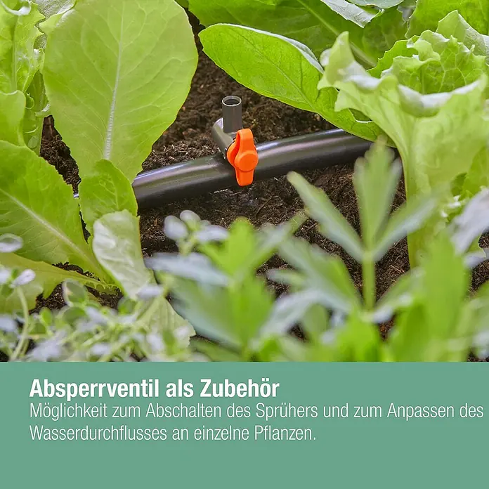 Gardena Micro-Drip Streifendüse - 5 Stk., Wurfweite: 5,5 m - Nahaufnahme eines Absperrventils in einem Gartenbeet mit Pflanzen.